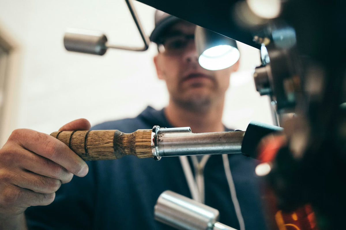 Temporary reference: a craftsperson working at a wood lathe